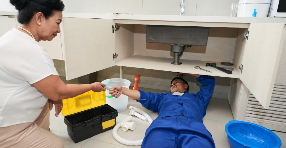 Couple working on Drain Cleaning at their home